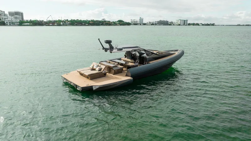 Slide: The Image of Anvera 48 luxury boat on calm water, 2025 model, with spacious deck and modern design. - 32