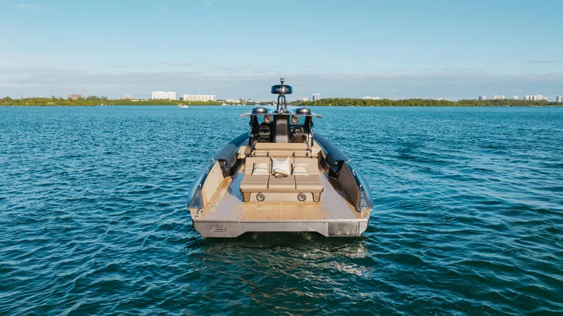 Slide: The Image of Anvera 48 luxury yacht on open water, 2025 model, rear view. - 35