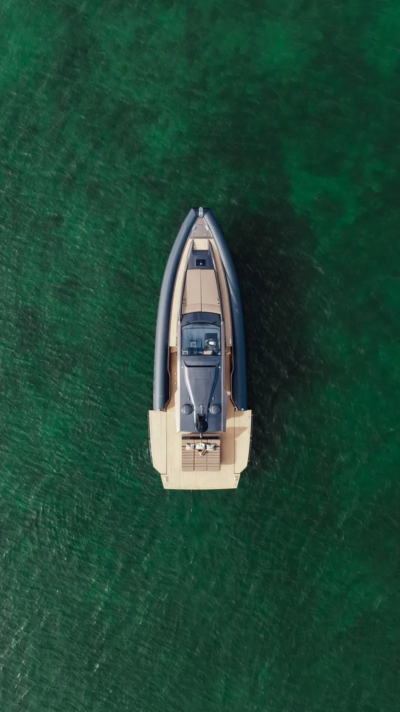 Slide: The Image of Aerial view of 2025 Anvera 48 yacht on clear green water. - 39