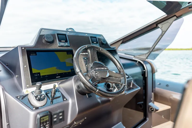 Slide: The Image of Cockpit of 2025 Anvera 48 boat with advanced navigation system and steering wheel. - 4