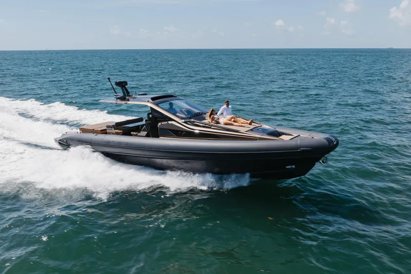 Slide: The Image of 2025 Anvera 48 luxury yacht cruising on open sea with passengers relaxing. - 40