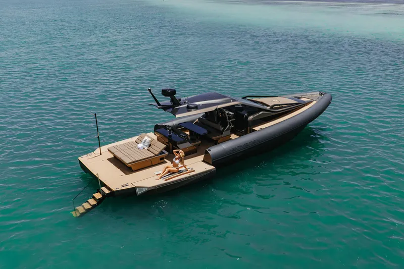 Slide: The Image of Luxury Anvera 48 yacht, 2025 model, cruising in clear turquoise waters. - 43