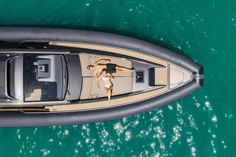Slide: The Image of Aerial view of Anvera 48 yacht, 2025 model, with two people sunbathing on deck. - 45