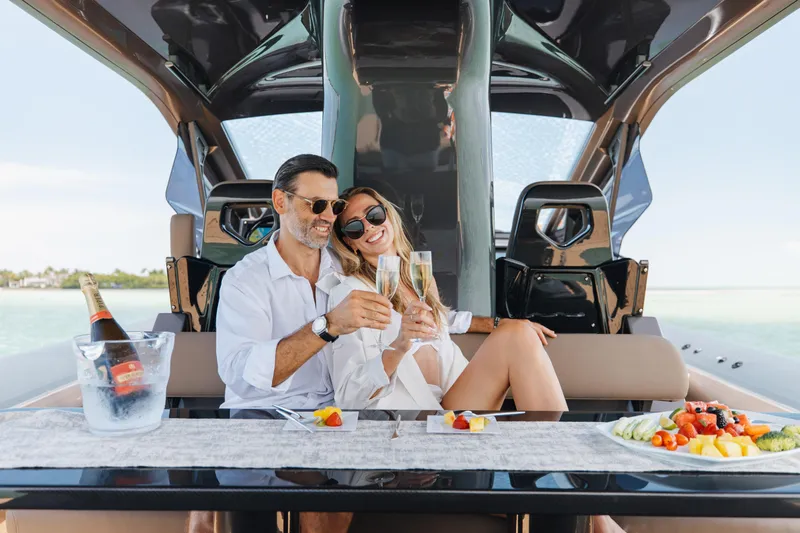 Slide: The Image of Couple enjoying champagne on Anvera 48 yacht, 2025 model, with fruit platter. - 51