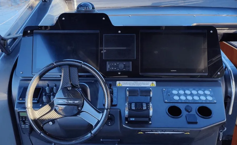 Slide: The Image of Control panel of 2025 Anvera ANVERA 58 yacht with steering wheel and digital displays. - 10