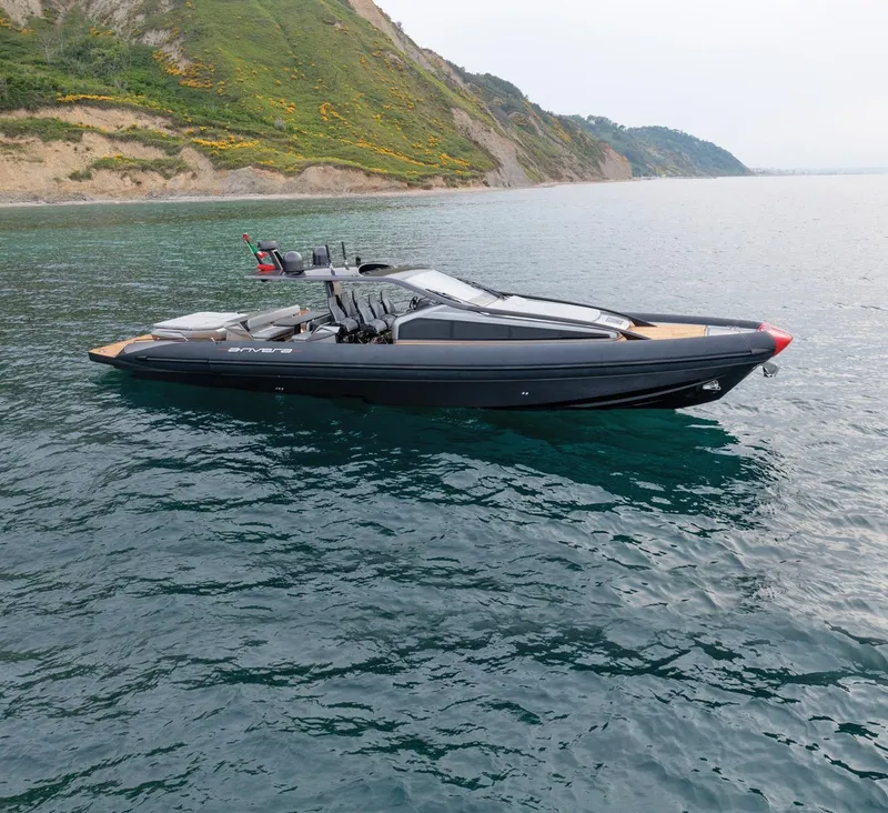Slide: The Image of 2025 Anvera ANVERA 58 yacht cruising near a scenic coastline. - 2