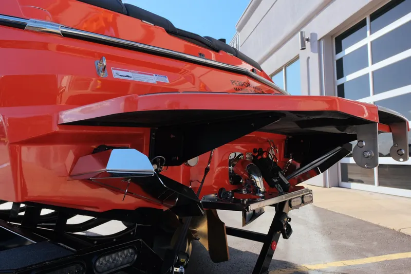 Slide: The Image of 2025 MasterCraft NXT24 boat rear view, showcasing sleek design and modern features. - 11