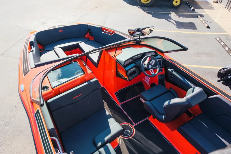 Slide: The Image of 2025 MasterCraft NXT24 boat interior with sleek design and modern dashboard. - 13