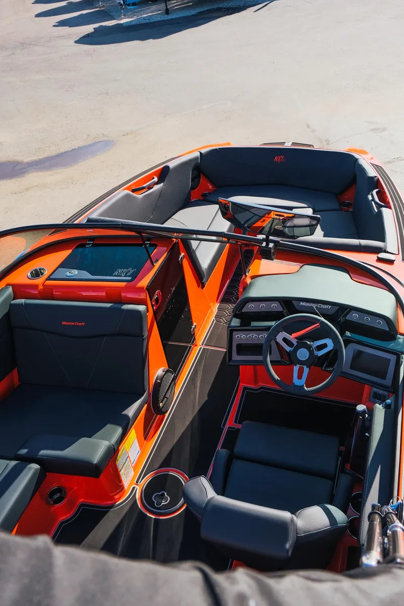 Slide: The Image of 2025 MasterCraft NXT24 boat interior with modern design and seating. - 15