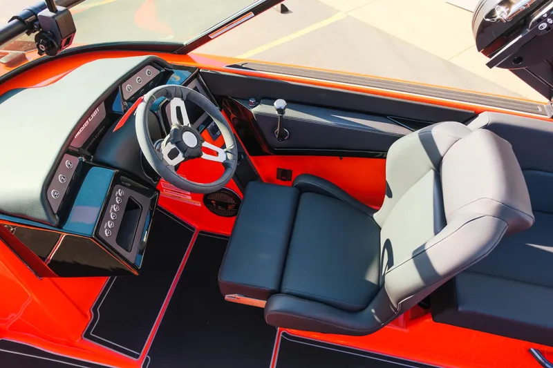 Slide: The Image of 2025 MasterCraft NXT24 boat interior with sleek steering wheel and modern dashboard. - 17