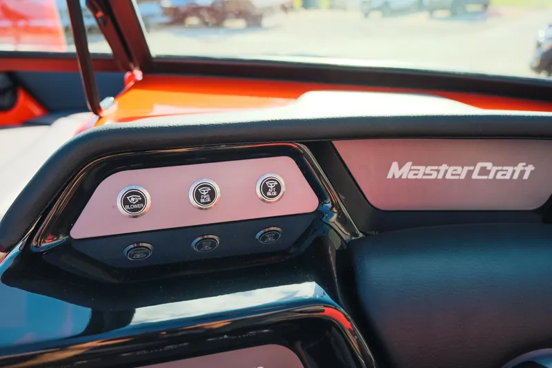 Slide: The Image of Dashboard controls of 2025 MasterCraft NXT24 boat with branded panel. - 19