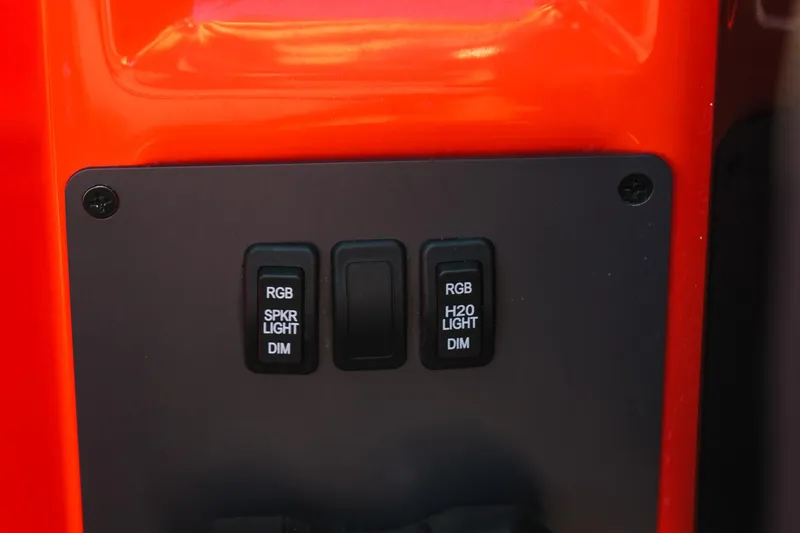 Slide: The Image of Control panel of 2025 MasterCraft NXT24 with RGB lighting switches. - 22