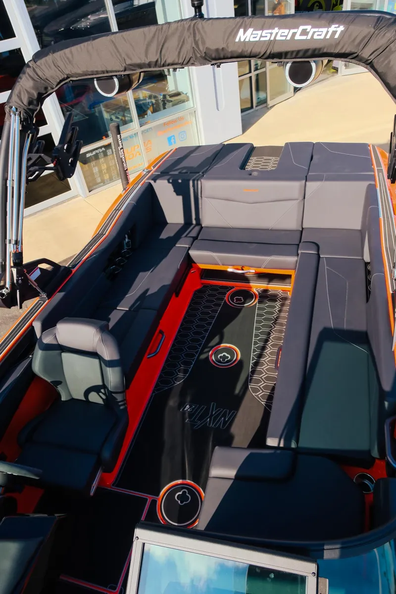 Slide: The Image of 2025 MasterCraft NXT24 boat interior with sleek seating and modern design. - 28