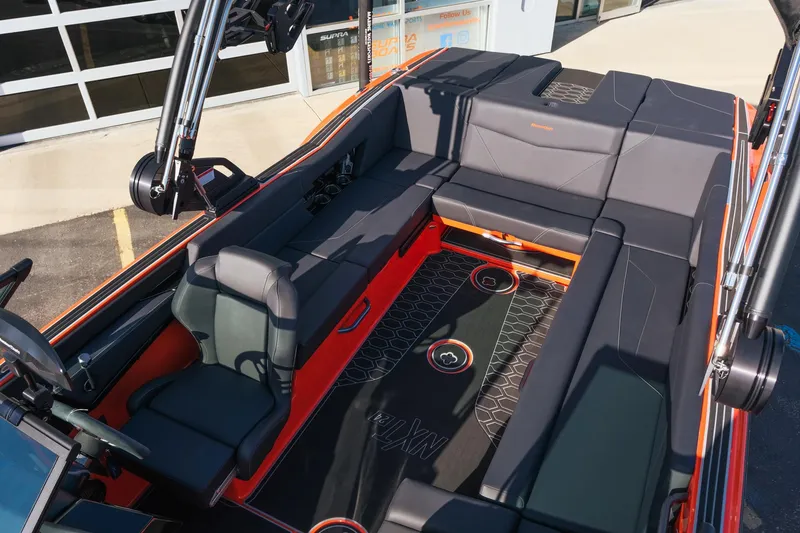Slide: The Image of 2025 MasterCraft NXT24 boat interior with sleek seating and modern design. - 29