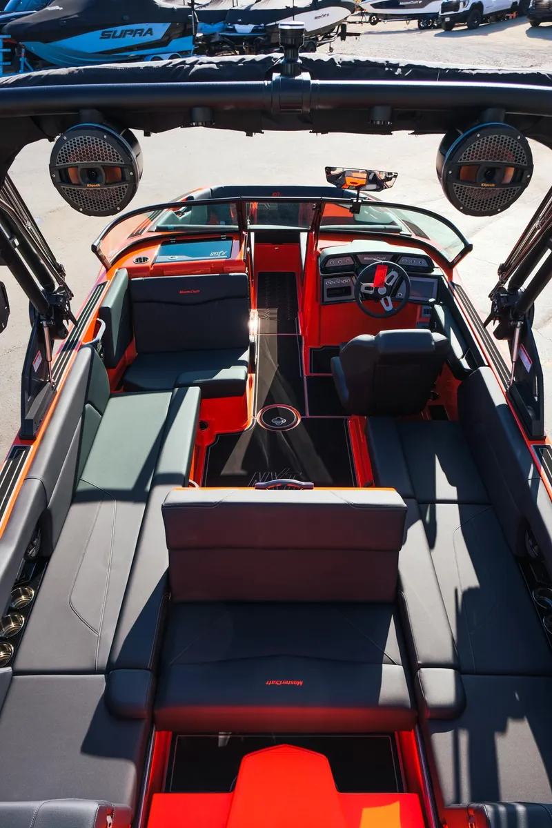 Slide: The Image of 2025 MasterCraft NXT24 boat interior with modern seating and advanced dashboard. - 31