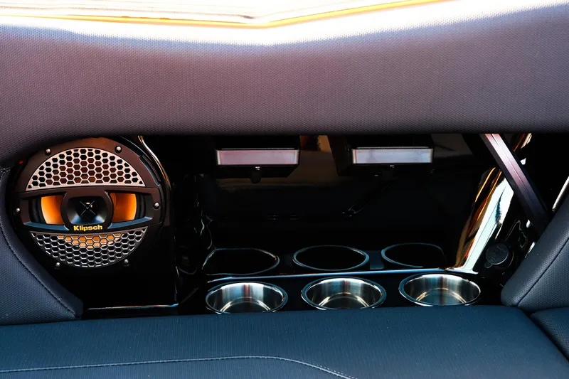 Slide: The Image of 2025 MasterCraft NXT24 interior with Klipsch speaker and cup holders. - 34