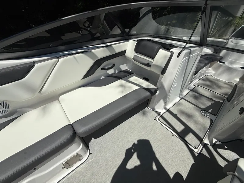 Slide: The Image of 2022 Yamaha AR210 boat interior with sleek seating and modern design. - 15