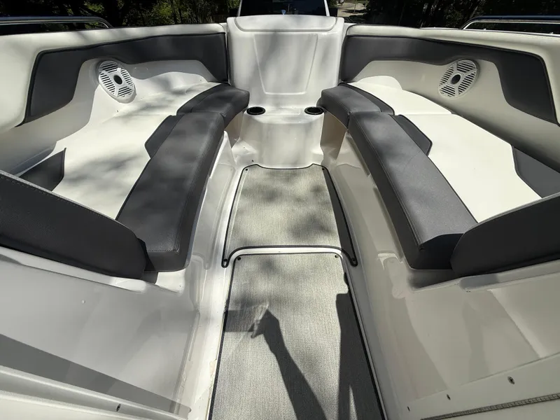Slide: The Image of Interior view of 2022 Yamaha AR210 boat, featuring spacious seating and modern design. - 18