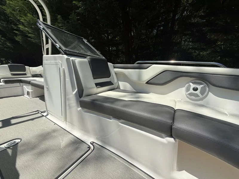 Slide: The Image of 2022 Yamaha Boats AR210 interior with sleek seating and modern design. - 21
