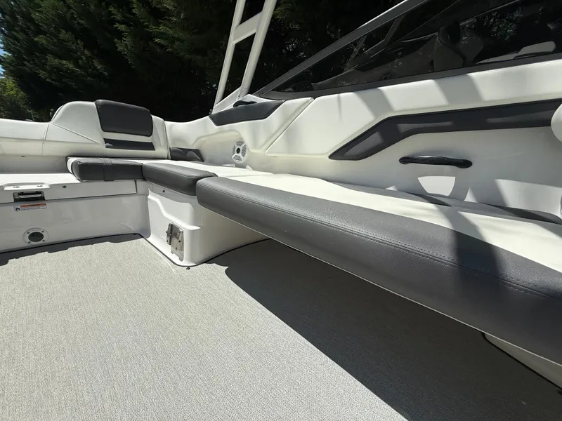 Slide: The Image of 2022 Yamaha Boats AR210 interior with sleek seating and modern design. - 26