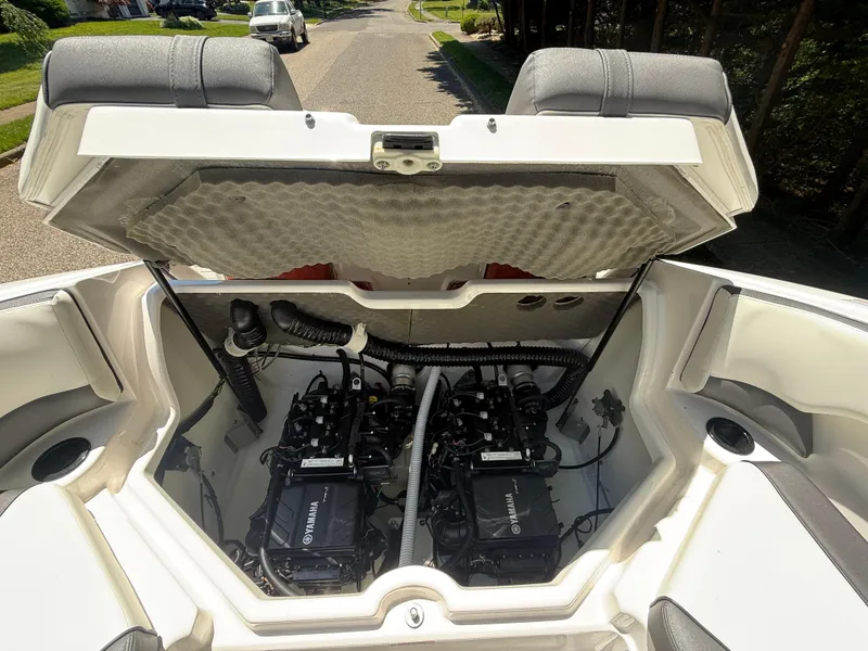 Slide: The Image of 2022 Yamaha Boats AR210 engine compartment with open hatch, showcasing dual engines. - 28