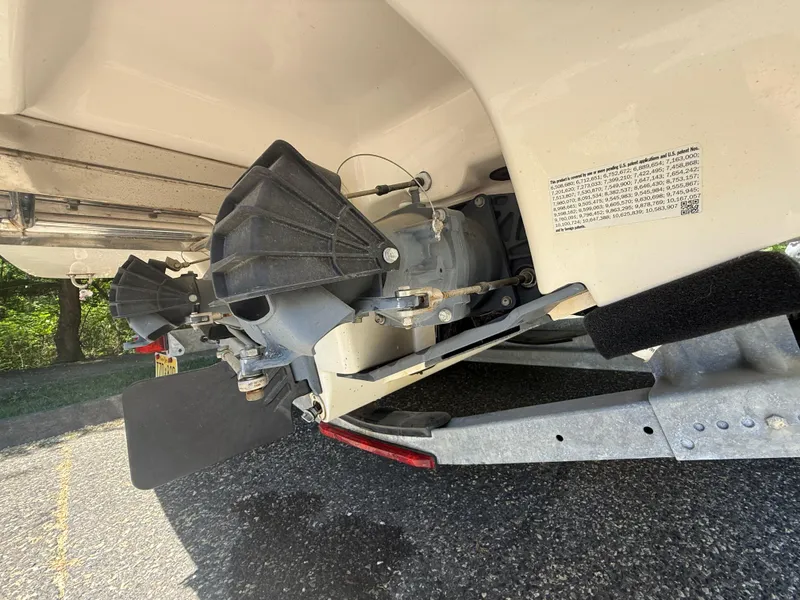 Slide: The Image of 2022 Yamaha AR210 boat jet propulsion system close-up on a trailer. - 32