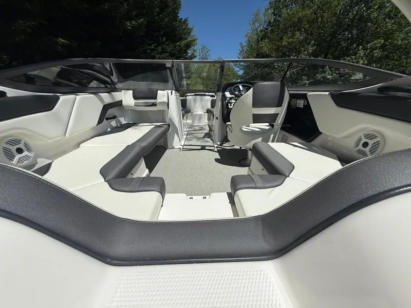 Slide: The Image of 2022 Yamaha Boats AR210 interior with sleek seating and modern design. - 7