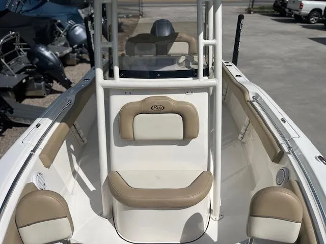 Slide: The Image of 2020 Key West 219 FS boat interior with beige seating and console. - 11