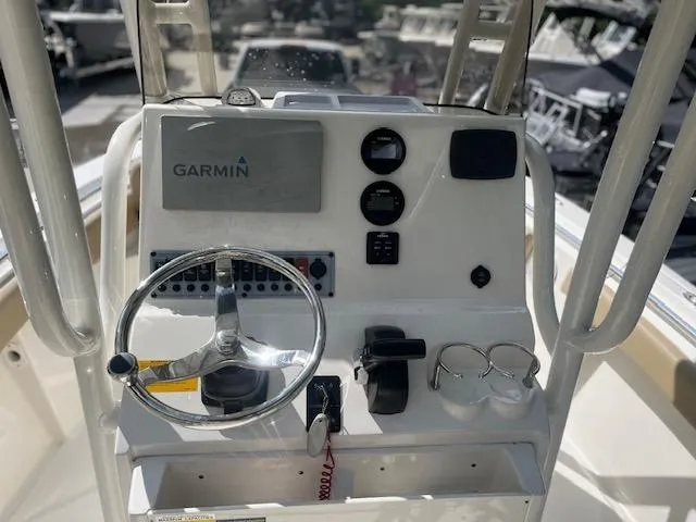 Slide: The Image of 2020 Key West 219 FS boat console with Garmin navigation system and steering wheel. - 7