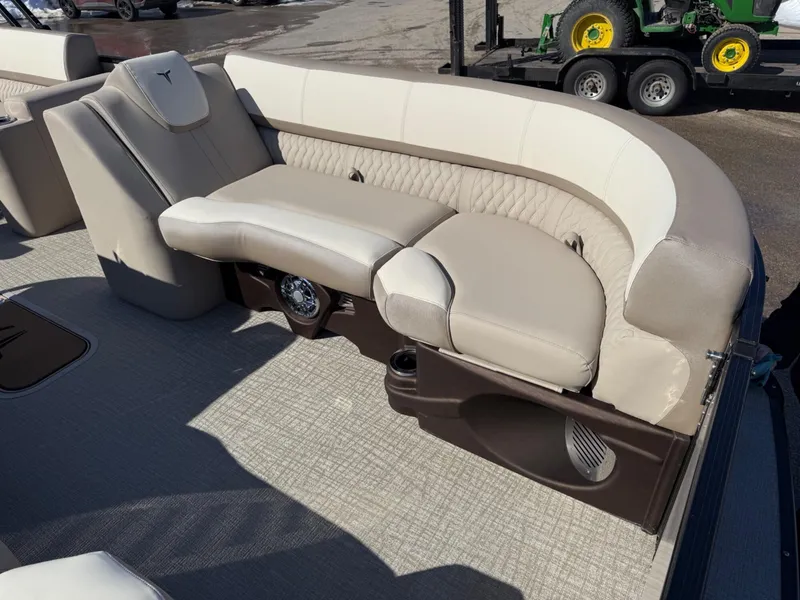 Slide: The Image of 2025 Tahoe Pontoon Cascade Versatile Rear Lounger with beige seating and modern design. - 12