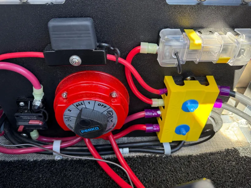 Slide: The Image of Electrical panel with red switch and wiring on 2025 Tahoe Pontoon Cascade Versatile Rear Lounger. - 17