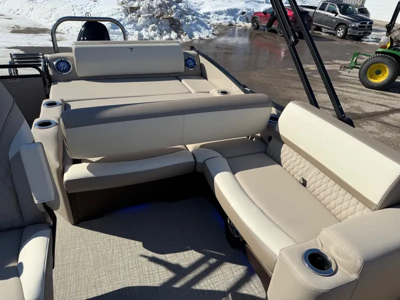 Slide: The Image of 2025 Tahoe Pontoon Cascade Versatile Rear Lounger with beige seating and cup holders. - 4