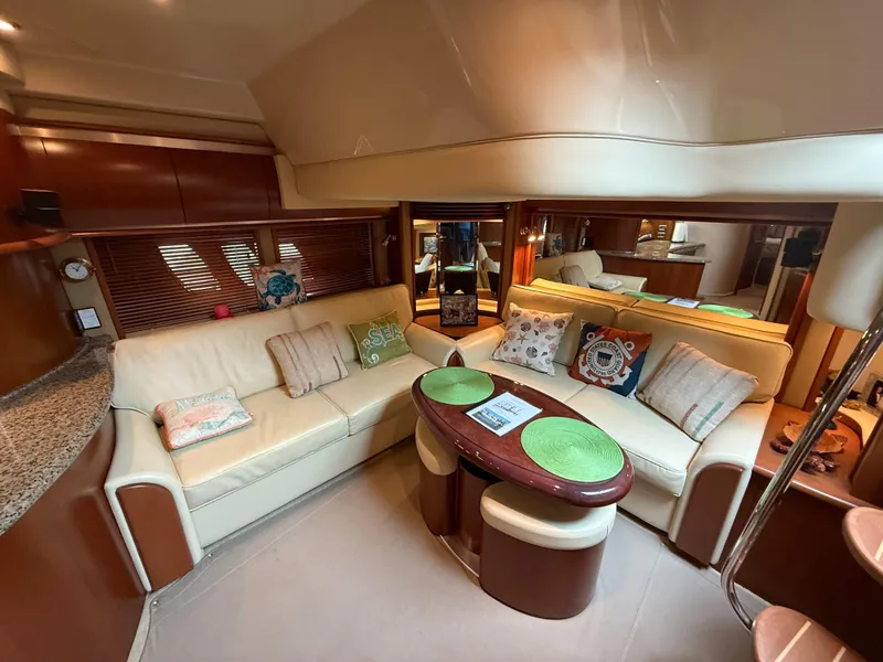 Slide: The Image of Luxurious interior of 2006 Sea Ray 52 Sundancer yacht with plush seating and elegant decor. - 13