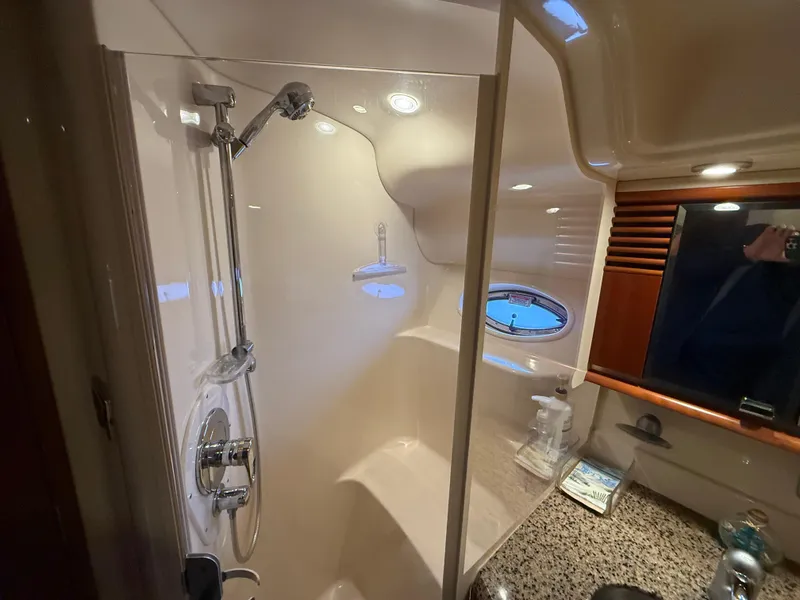 Slide: The Image of Luxurious bathroom interior of 2006 Sea Ray 52 Sundancer yacht with shower and porthole window. - 22