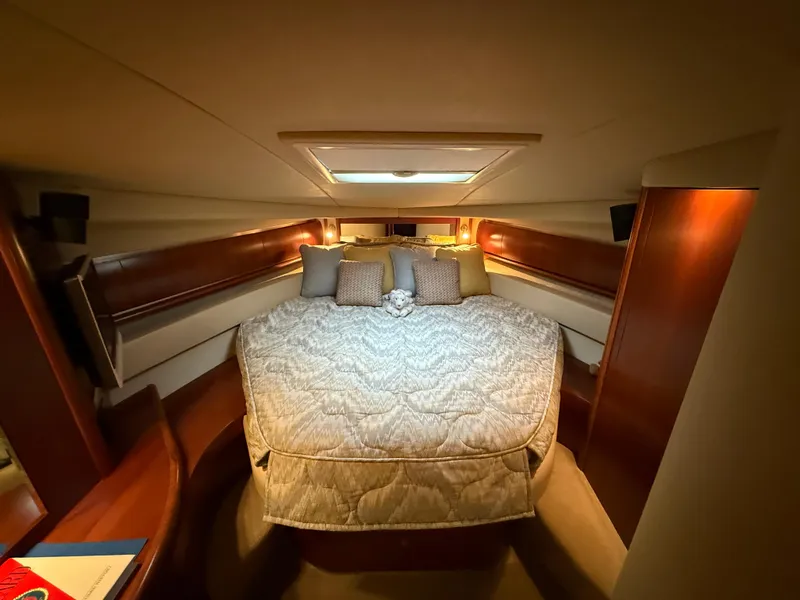 Slide: The Image of Luxurious cabin interior of 2006 Sea Ray 52 Sundancer yacht with cozy bedding. - 24