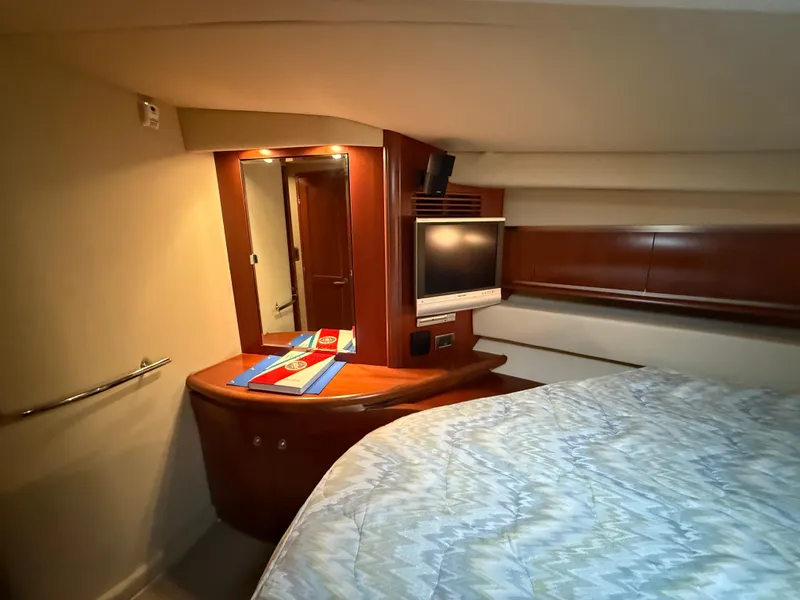 Slide: The Image of Luxurious cabin interior of 2006 Sea Ray 52 Sundancer yacht with TV and mirror. - 25