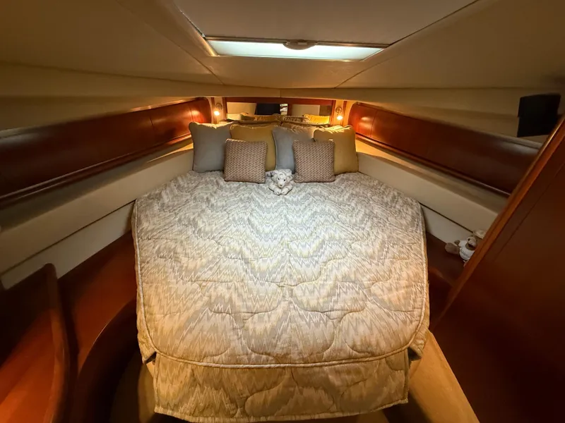 Slide: The Image of Luxurious cabin interior of 2006 Sea Ray 52 Sundancer yacht with cozy bedding. - 26
