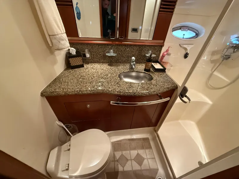 Slide: The Image of Luxurious bathroom in 2006 Sea Ray 52 Sundancer yacht with granite countertop and shower. - 27