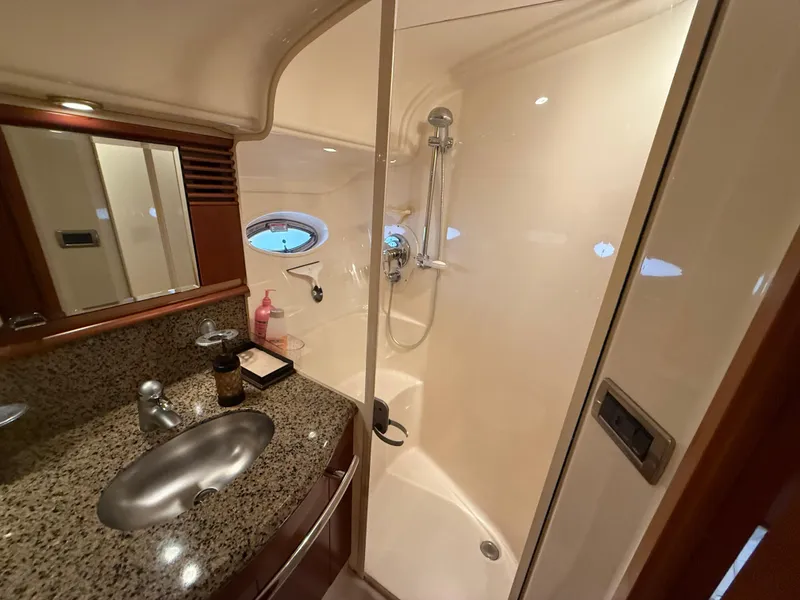 Slide: The Image of Luxurious bathroom in 2006 Sea Ray 52 Sundancer yacht with granite countertop and shower. - 28