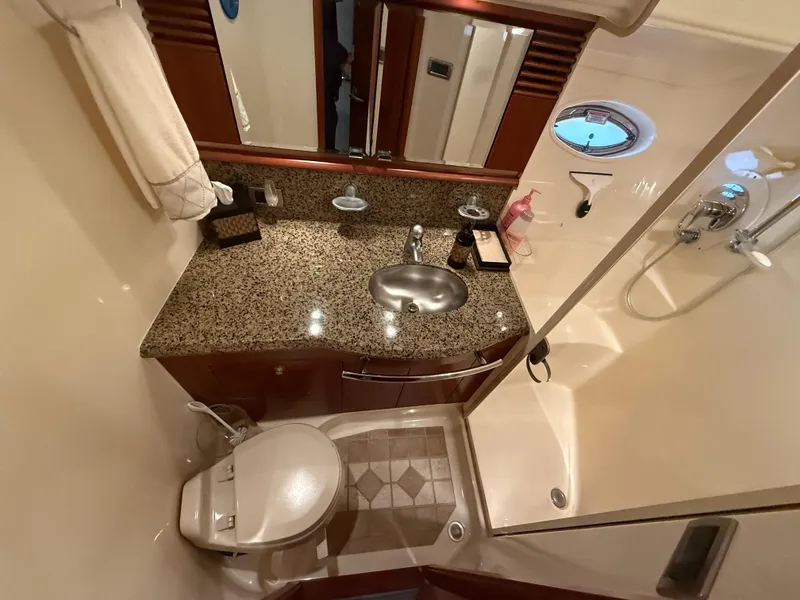 Slide: The Image of Luxurious bathroom in 2006 Sea Ray 52 Sundancer yacht with granite countertop and shower. - 30