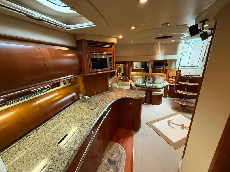 Slide: The Image of Luxurious interior of a 2006 Sea Ray 52 Sundancer yacht with modern amenities. - 32