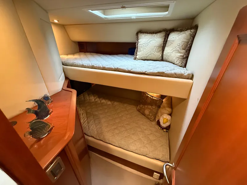 Slide: The Image of Bunk beds in 2006 Sea Ray 52 Sundancer yacht cabin with decorative pillows. - 33