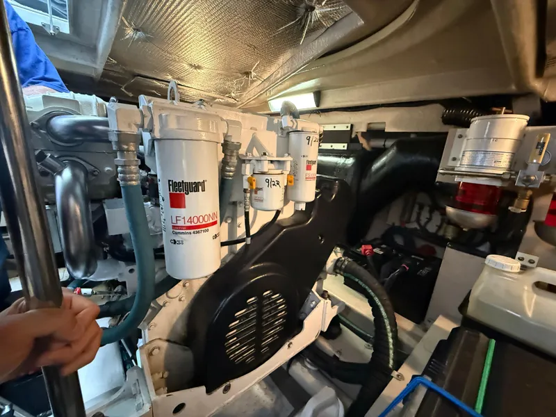Slide: The Image of Engine room of 2006 Sea Ray 52 Sundancer with visible filters and components. - 44