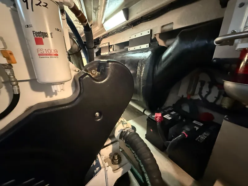 Slide: The Image of Engine room of 2006 Sea Ray 52 Sundancer with visible components and batteries. - 45