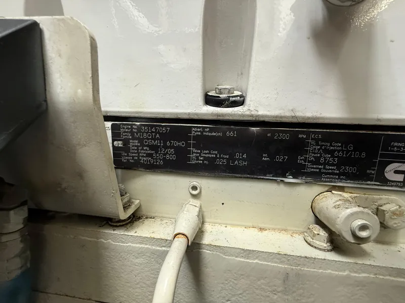 Slide: The Image of Engine label on a 2006 Sea Ray 52 Sundancer boat, displaying technical specifications. - 48