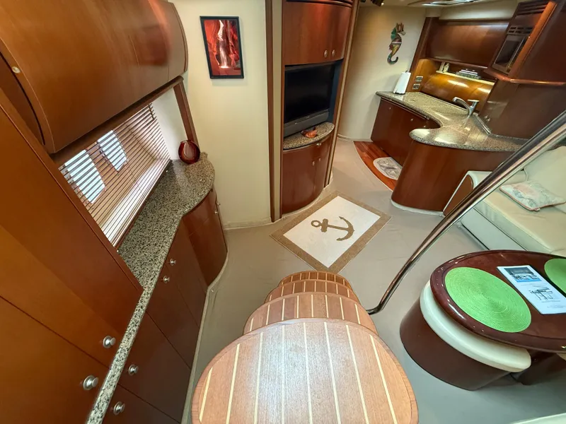 Slide: The Image of Luxurious interior of 2006 Sea Ray 52 Sundancer yacht with elegant wood finishes. - 8