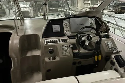 Slide: The Image of 2008 Cruisers Yachts 360 Express helm with Garmin navigation system and modern controls. - 14