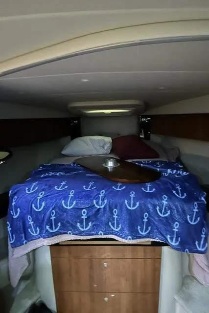 Slide: The Image of 2008 Cruisers Yachts 360 Express cabin with anchor-themed bedding. - 17