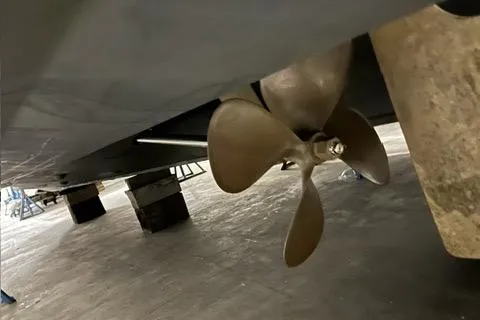 Slide: The Image of Propeller of 2008 Cruisers Yachts 360 Express, viewed from below in a dry dock setting. - 23