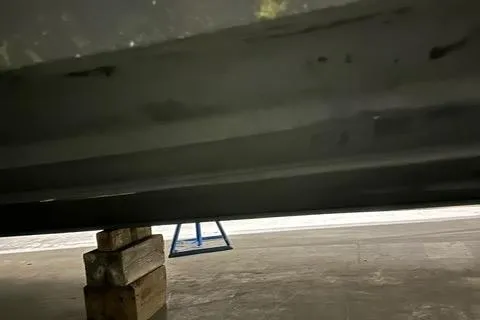 Slide: The Image of 2008 Cruisers Yachts 360 Express hull on blocks in a workshop. - 27